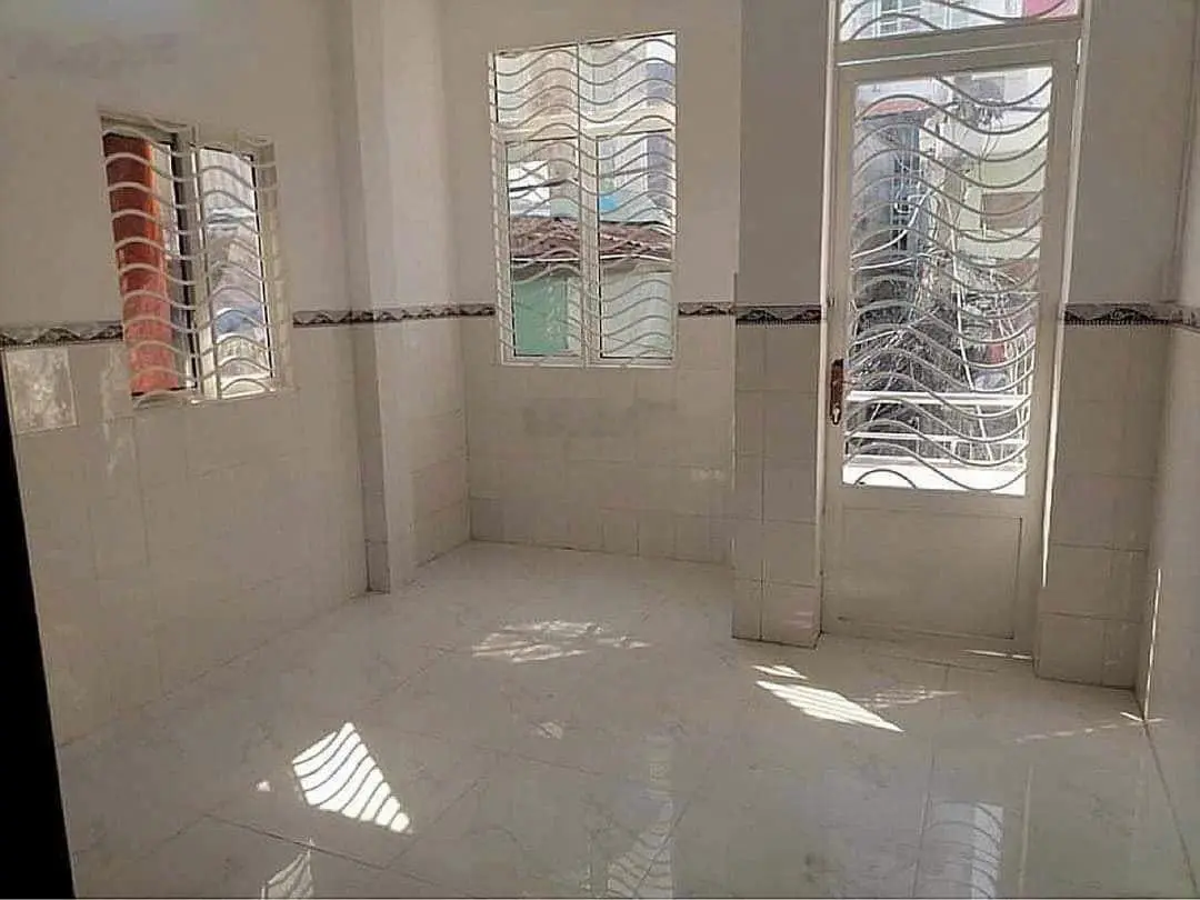 Bán nhà sổ hồng riêng - 2 lầu - đ.trần xuân soạn - không bị ngập nước.